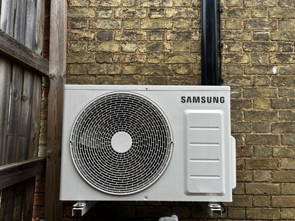 Image shows Samsung Dual Split Air Conditioning Installation on the exterior wall