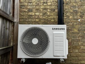 Image shows Samsung Dual Split Air Conditioning Installation on the exterior wall